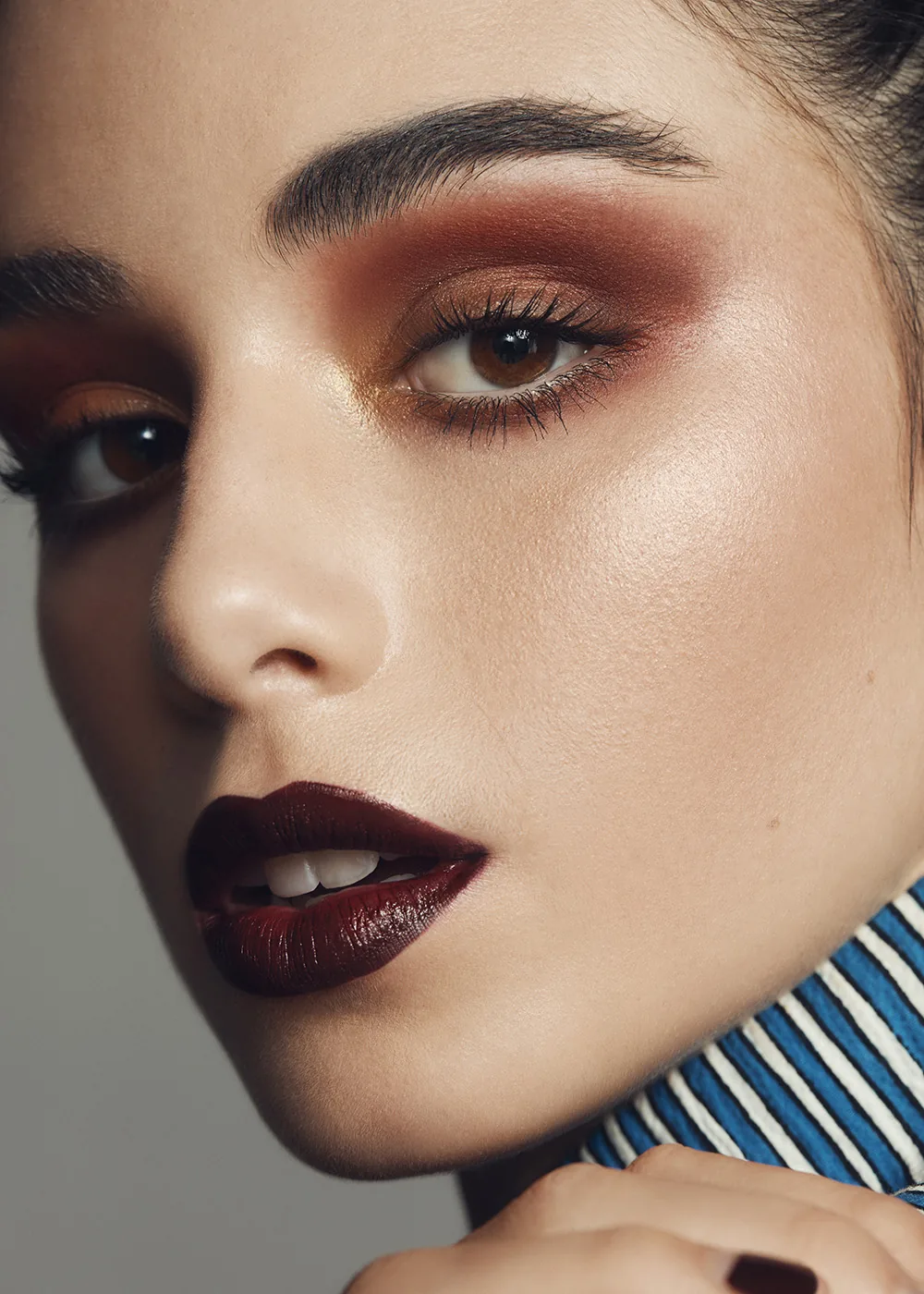 Dark cherry lip and bronze smoky-eye editorial by Bonnie Gillies