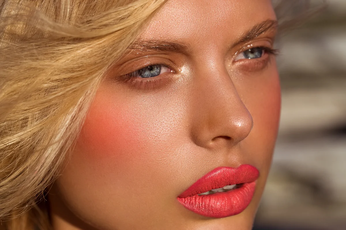 Coral matte lip and dewy blush close-up beauty by Bonnie Gillies