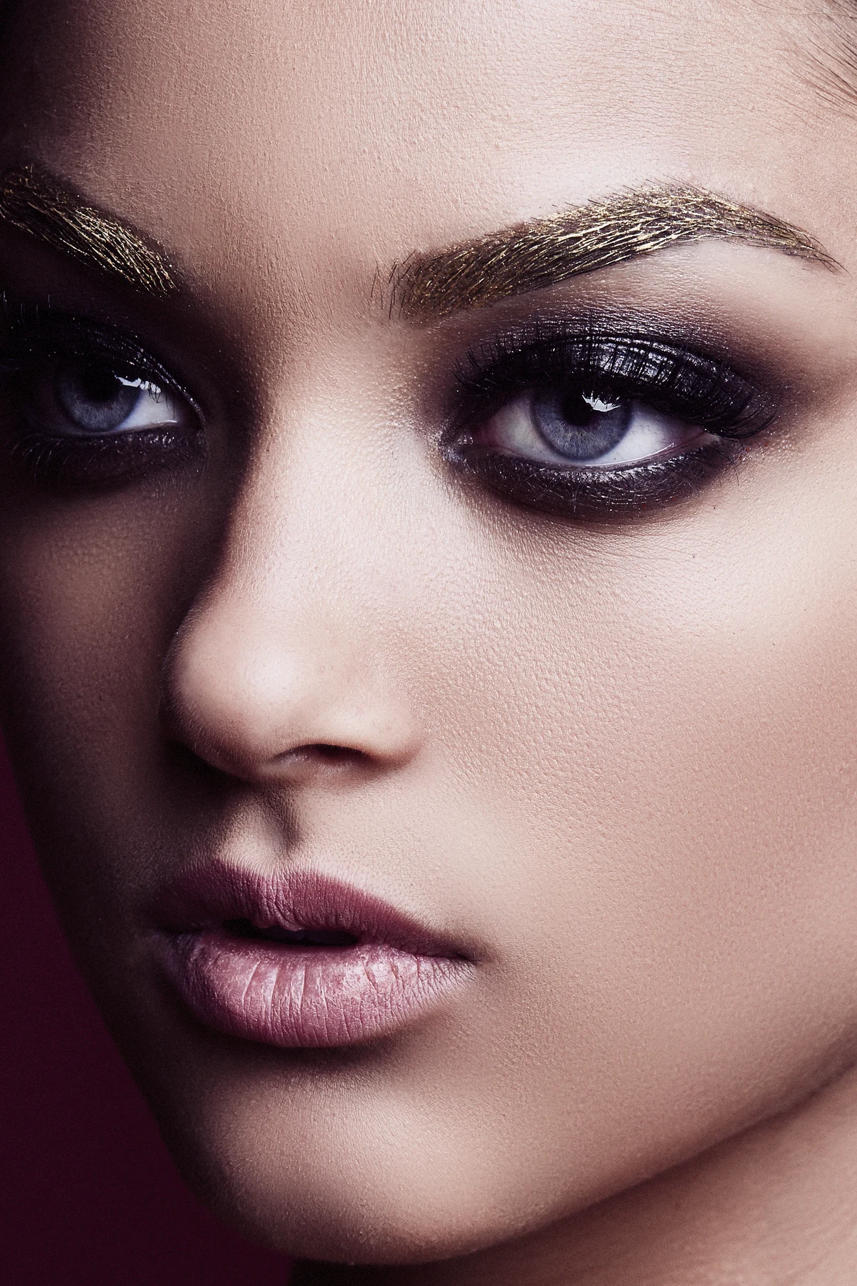 Gold-leaf brow and smoky eye editorial by Bonnie Gillies