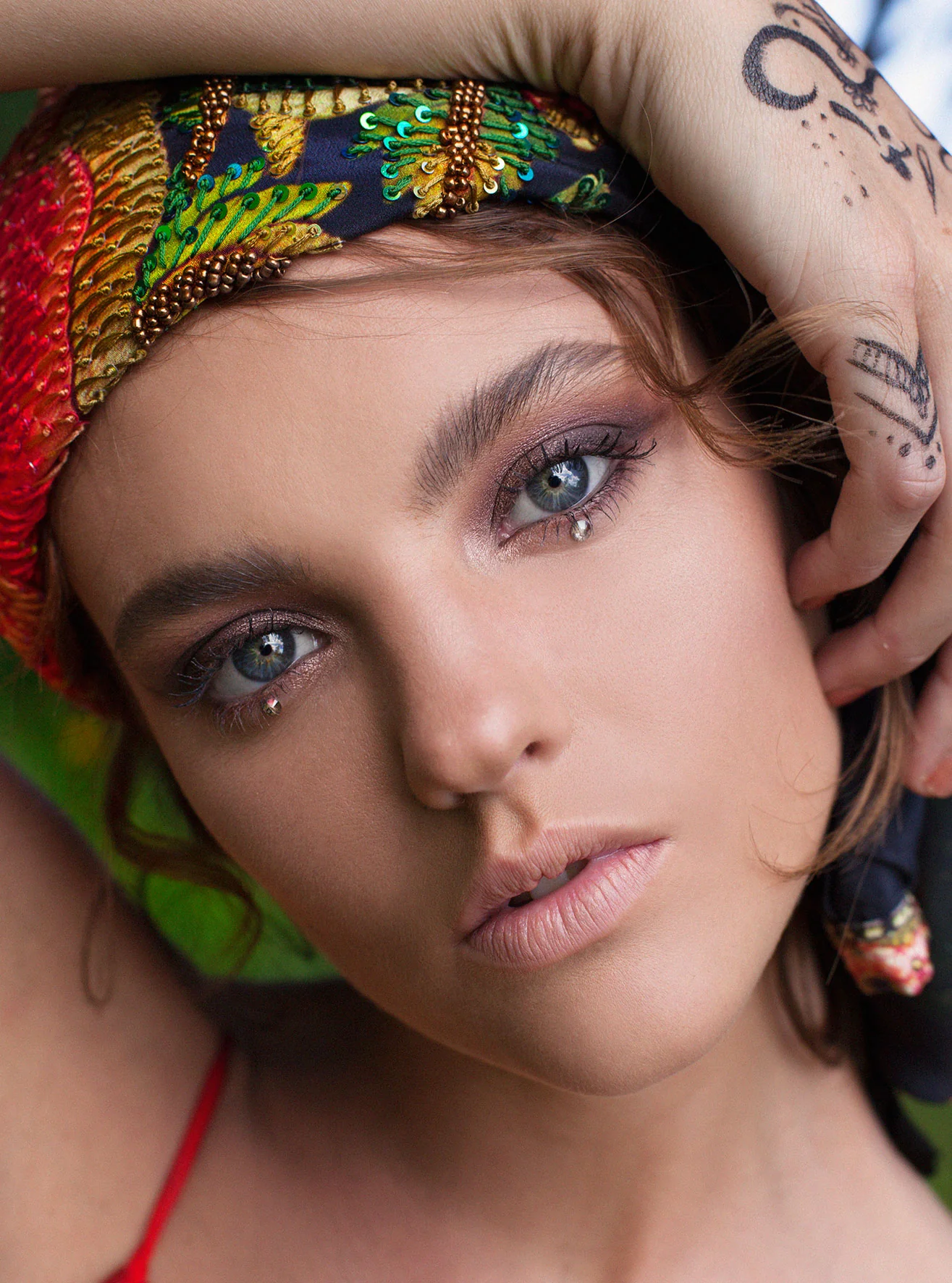 Rainbow embellished headband and tear-jewel beauty editorial by Bonnie Gillies